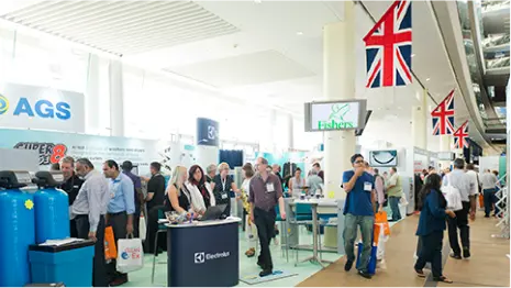 Attendees on a laundry exhibition floor